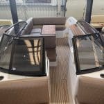 Sunset cruise aboard the Majestic II yacht with golden sky reflections
